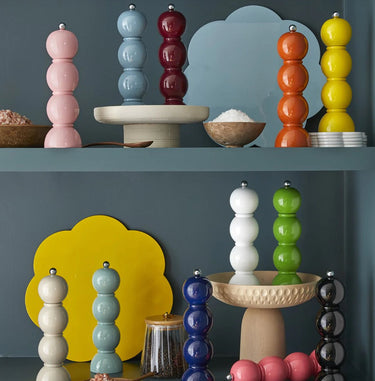 Bobbin Salt and Pepper Grinders by Addison Ross of London. Photo features multiple colors including pink, blue, navy, black, and yellow.
