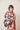 Model wearing the cinnamon and charcoal box kite wrap