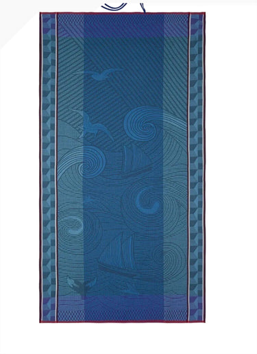 Blue patterned towel with a white border on a white background