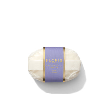 Bar of soap with a purple Floris label on a white background