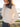 Cream sweater with scalloped hem