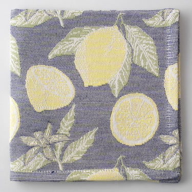 blue-grey napkin featuring a repeating yellow lemon print