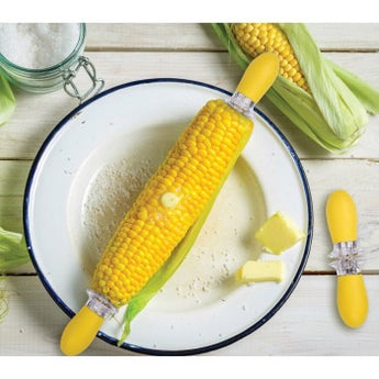 Yellow corn holders with ear of corn