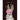 Greeting card with a rabbit's head featuring a pink flower and the text 'Thinking of You' on a dark background.