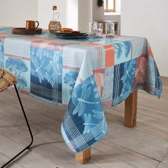 Blue and coral tablecloth featuring dragonfly’s and trees