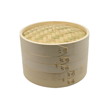 Bamboo steamer basket with lid on a white background