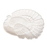 A white stoneware serving platter with an embossed turkey design, suitable for Thanksgiving dinner.