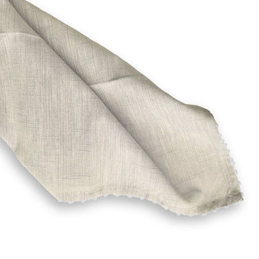 Beige fabric swatch on a white background