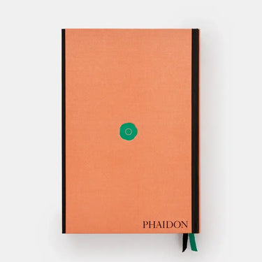 Orange notebook with black binding and green accent on a white background