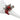 Red and green decorative napkin ring on a white napkin against a white background