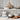 Set of white cookware on a kitchen shelf with wooden cutting board and eggs.