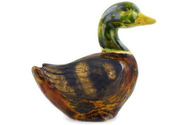 Wooden duck figurine on a white background