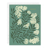 Notebook cover with floral design and 'grateful' text on a green background