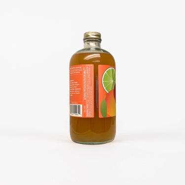A glass bottle of Mango Habanero Margarita cocktail-mocktail mixer with a red and orange label.