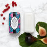 Bar of Fig and Cassis soap wrapped in floral paper.