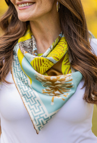Model wears silk scarf Around neck