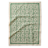 Rifle Paper Co. Artichoke pattern in green and cream on a tea towel.