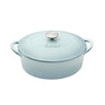 Light blue cast iron cookware with a lid on a white background