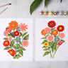 Cate Paper Co. - Zinna Blooms Paint-By-Numbers kit Shown with nearly fully painted pictures