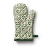 Rifle Paper Co. Artichoke pattern in green and cream on an oven mitt. Mitt has solid green trim and loop.