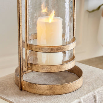Gold and glass pillar candle holder