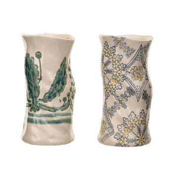 Two hand-painted vases, one has a green floral motive, one has a blue and yellow floral motif