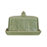 Green stoneware butter dish debossed with tree motif. Lid has a geometric pine tree handle