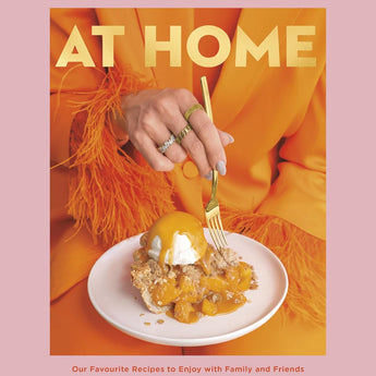 Cover is pink with an inset image of a woman wearing a bright orange jacket with feathers at the cuff holding a white plate on which sits a piece of peach pie with a scoop of vanilla ice cream on top drizzled with caramel.