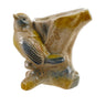 Ceramic hand painted bird vase in blue, yellow, and orange. Bird looking up alongside a piece of wood.