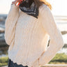 Cream sweater with scalloped hem