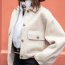 Wool bomber jacket in a soft dove color with light buttons