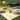 Cream tablecloth featuring vibrant yellow lemons 