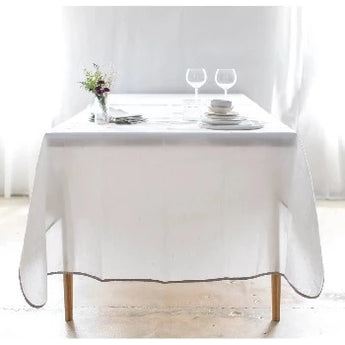 White linen tablecloth with natural border.