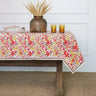 Garden Sunset Collection Tablecloth shown with dinnerware and floral accessory