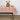Garden Sunset Collection Tablecloth shown with dinnerware and floral accessory