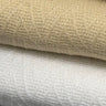 Details of Herringbone Thermal Waffle Coverlet Collection | Beige. It is sitting on top of the same blanket in white.