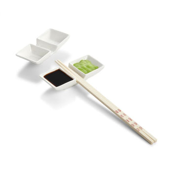 White porcelain chopstick rest with two sections for sauce