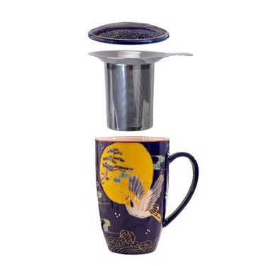 Decorative mug with a metal tea infuser on a white background