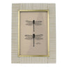 Framed artwork with dragonfly illustration on beige background