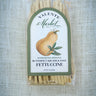 Packaged fettuccine with a label on a textured gray background