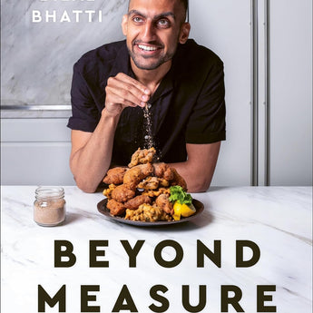 Beyond Measure Pakistani cooking by feel with Goldengully by Bilal Bhatti. Cover features Bilal Bhatti at a white marble kitchen island putting spices onto a dish of prepared food.