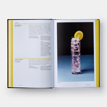 Open book showing a page with text and an image of a cocktail with ice and a lemon slice.