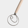 Metal whisk with wooden handle on a white background