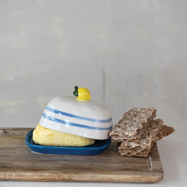 Blue and cream butter dish with yellow lemon knob.