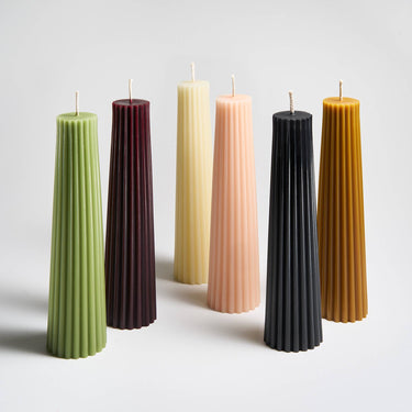 Several colors of Greentree’s Petite Pillar candles