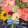 ‘Thinking about you’ cared with bouquet of flowers tied with a blue and white ribbon