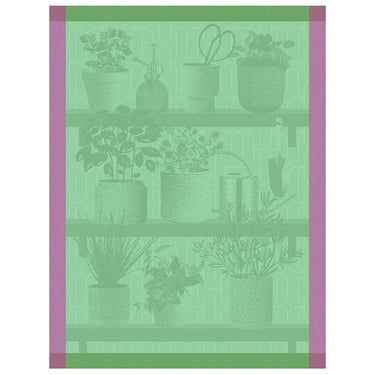 A beige tea towel with a floral and herbal design featuring various potted plants and gardening tools.