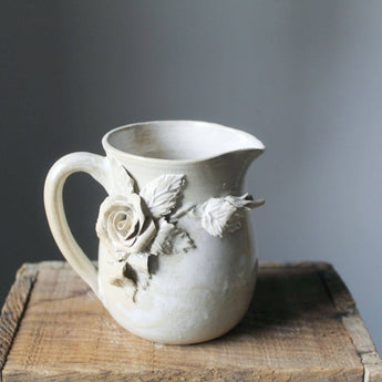 Ivory floral ceramic pitcher