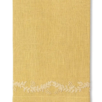 Yellow linen napkin with floral vine embroidery