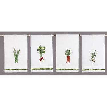 White towels with green embroidered edge and vegetables